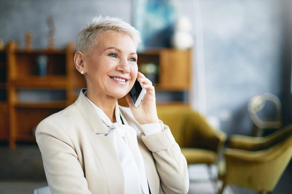 A woman speaking on her phone.